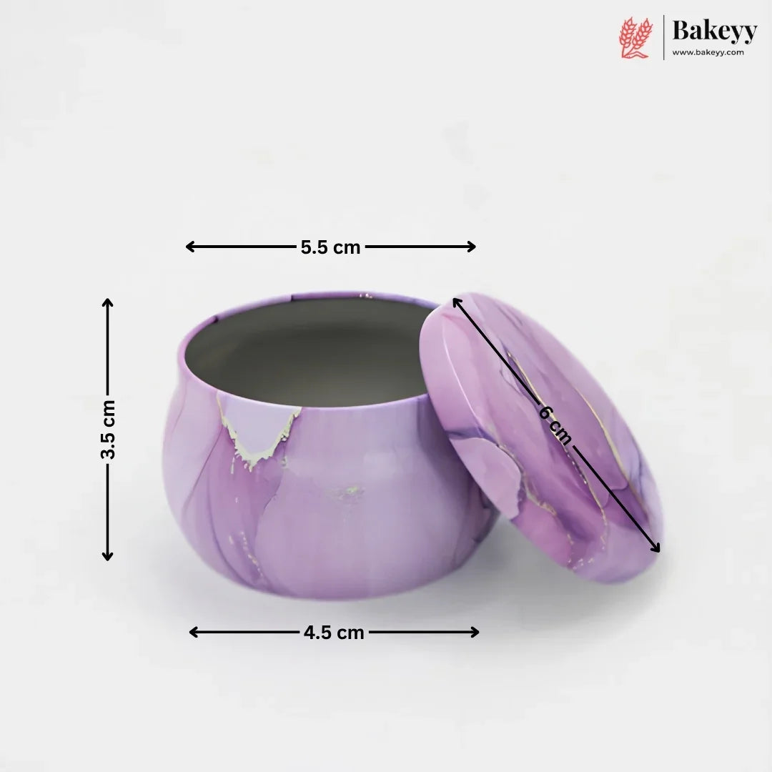 A purple marbled round metal tin with its lid leaning against it, shown on a white background with overlaid dimension arrows and labels indicating 3.5 cm height, 4.