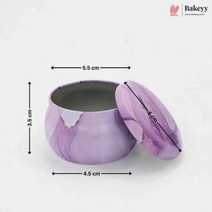 A purple marbled round metal tin with its lid leaning against it, shown on a white background with overlaid dimension arrows and labels indicating 3.5 cm height, 4.