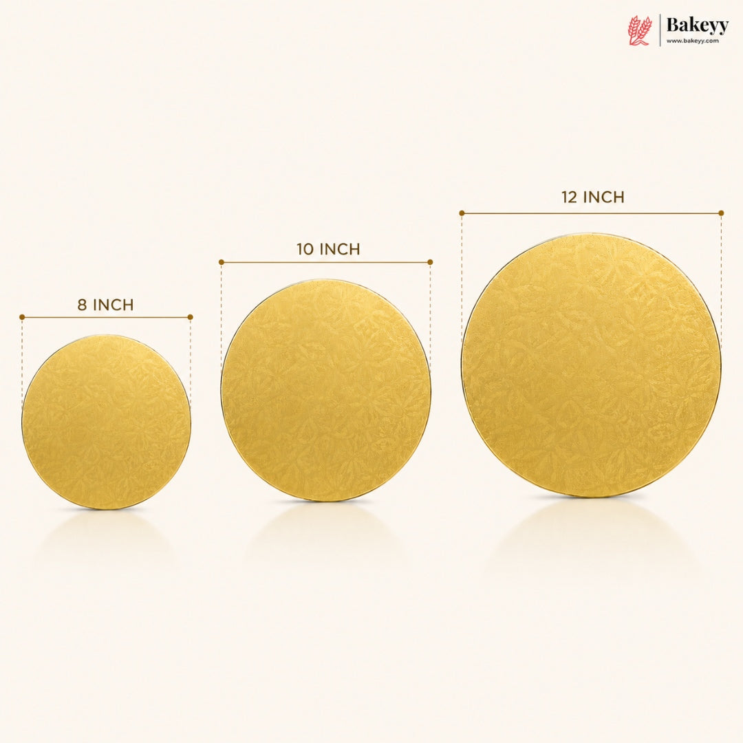 Three round gold-colored cake toppers of different sizes (8 inch, 10 inch, and 12 inch) displayed on a light cream background with dimension lines and text labels. The Bakeyy logo is visible in the top right corner.