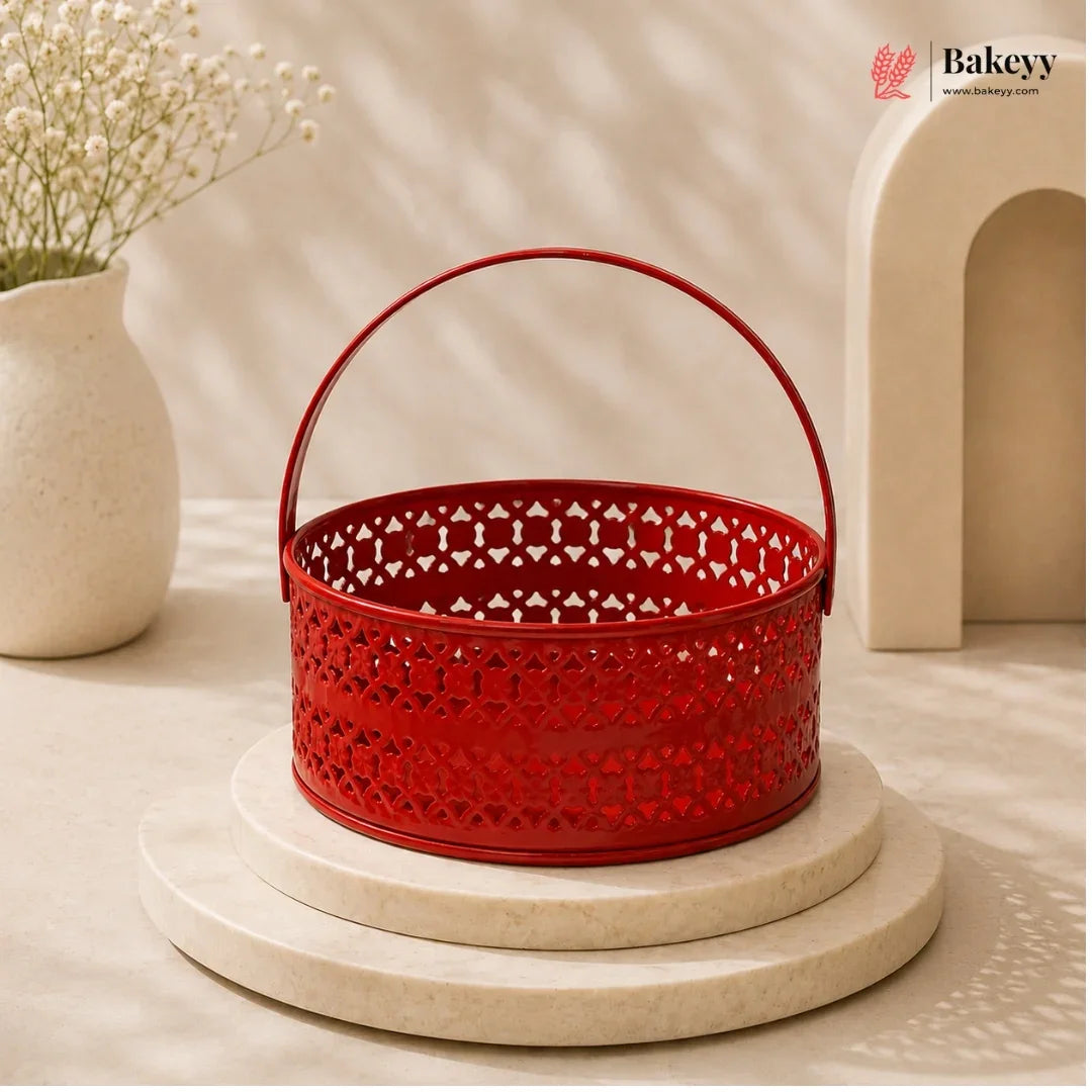 Red decorative basket with intricate patterns on a beige surface, featuring the Bakeyy brand.