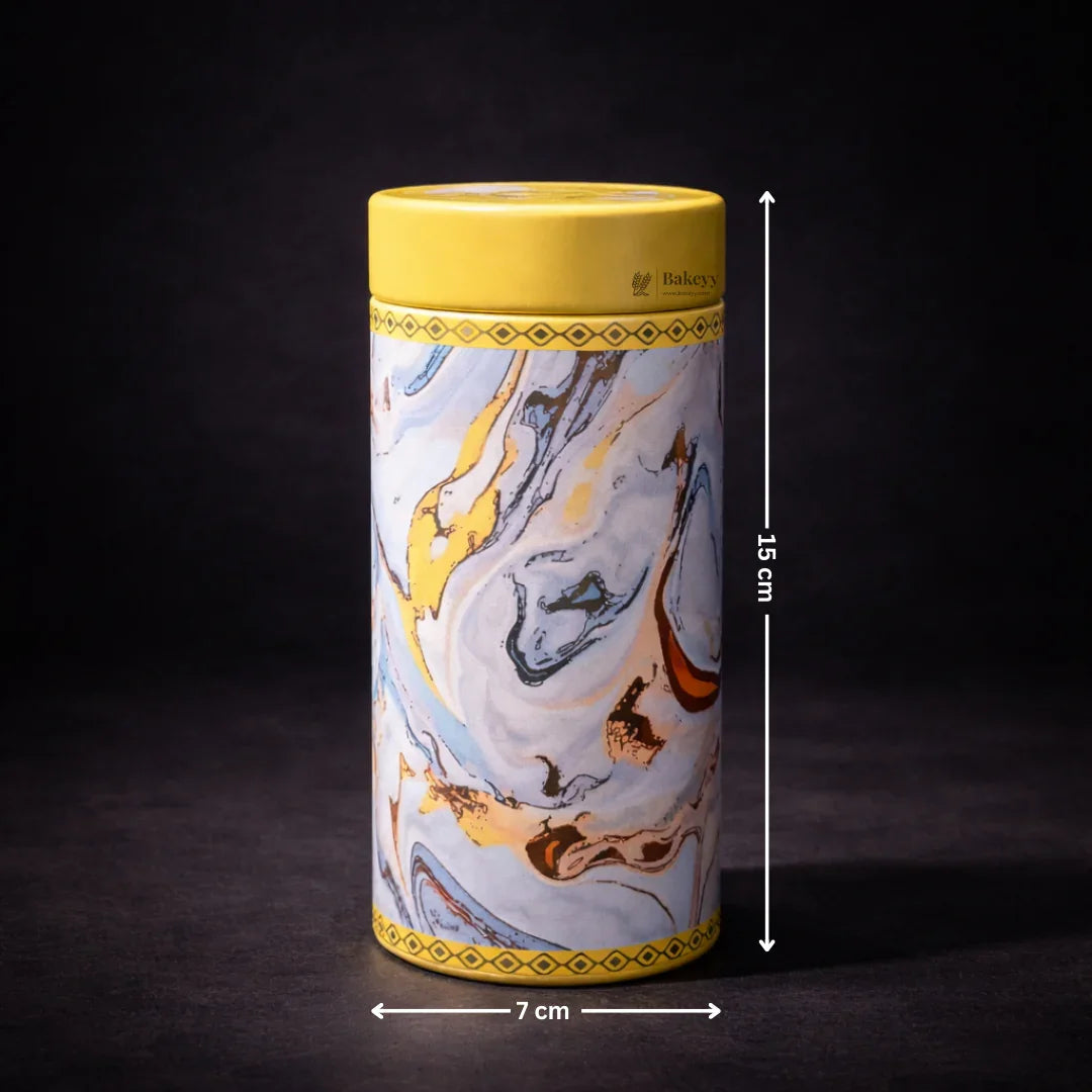 Round metal tin box with marbled yellow and blue design, 15cm tall, Bakeyy gift packaging.
