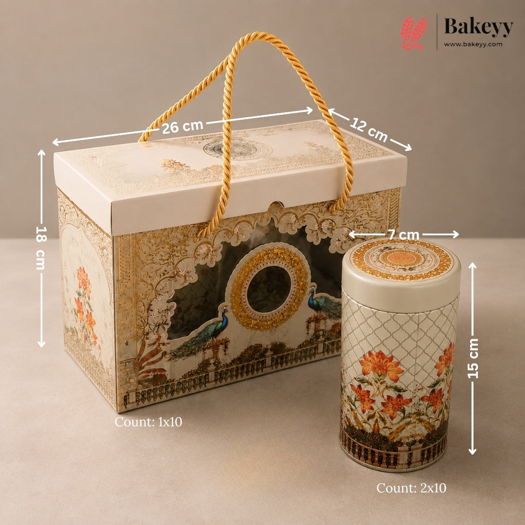 Decorative gift box and matching tin set with printed peacock and floral designs, shown with overlaid dimensions and counts on a neutral beige background. The Bakeyy logo appears in the top right.