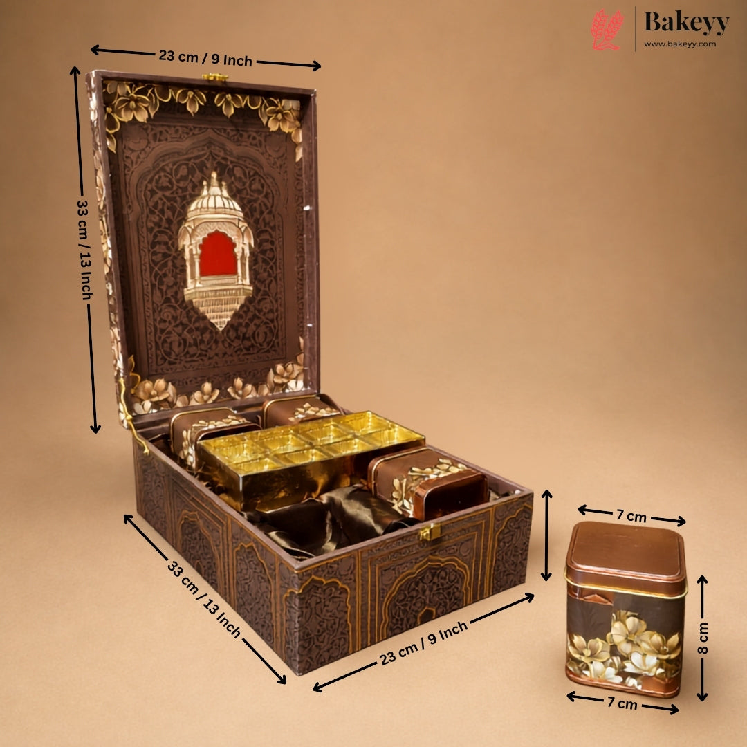 An ornate dark brown decorative storage box with gold detailing, shown open with smaller matching boxes inside. Black dimension arrows and labels indicate the measurements of the box and a separate matching container on a plain beige background.