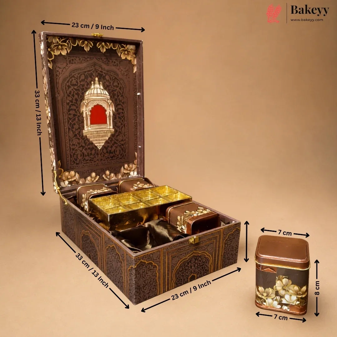 An ornate dark brown decorative storage box with gold detailing, shown open with smaller matching boxes inside. Black dimension arrows and labels indicate the measurements of the box and a separate matching container on a plain beige background.