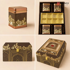 Four-panel product display of an ornate tea gift set and matching storage boxes on a warm beige background. The set includes a square copper-toned tin with gold floral decoration, a boxed arrangement of smaller matching tins and gold trays, a rectangular lidded box with gold floral detailing, and a decorative lidded storage box with intricate gold patterns.