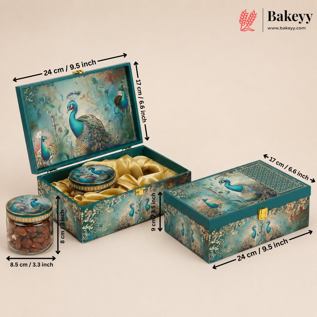 Decorative peacock-themed gift box set with dimensions shown, including an open box with gold ribbon, a closed box, and a small jar, on a beige background with the Bakeyy logo.