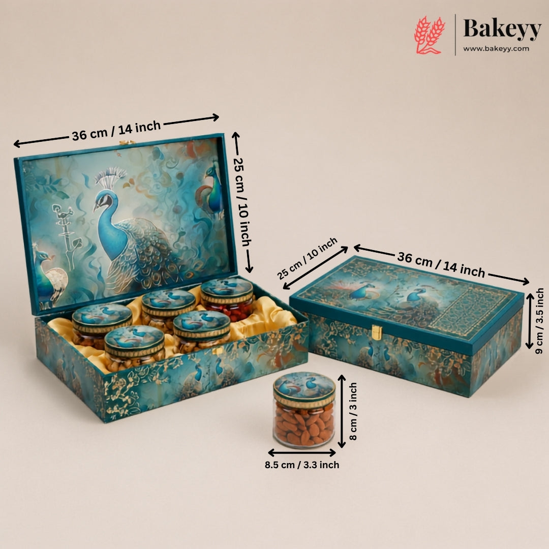 Decorative blue peacock-themed gift box set with six small jars, shown open and closed with printed dimensions in centimeters and inches. A single jar is placed in front.