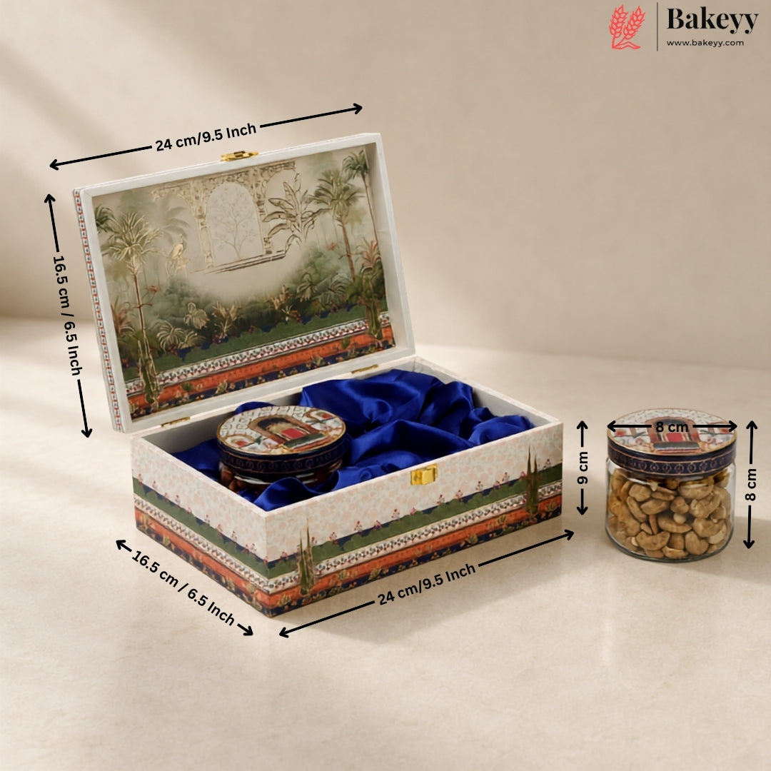 A decorative rectangular gift box with a tropical landscape print on the lid and sides, lined with blue velvet, shown open with dimension arrows and labels indicating 24 cm by 16.5 cm by 9 cm.