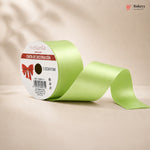 Green ribbon with a white label on a beige background