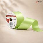 Green ribbon with a white label on a beige background