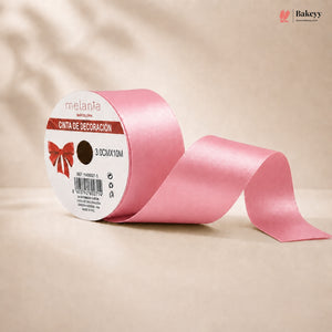 Pink ribbon with a label on a beige background