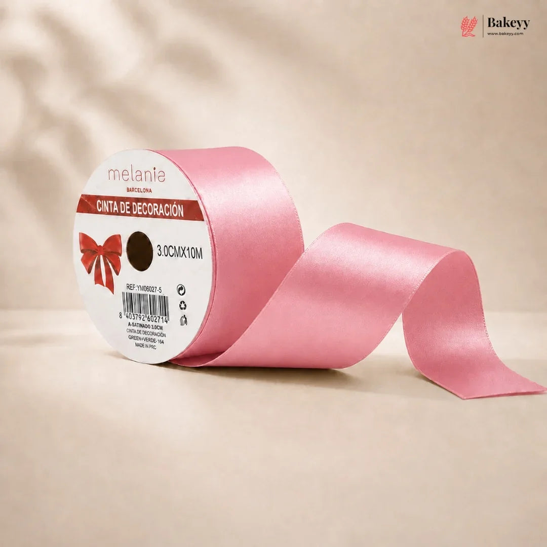 Pink ribbon with a label on a beige background