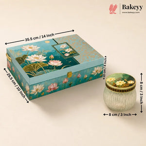 Decorative rectangular storage box with a lily pond print, shown alongside a small ribbed glass jar. The image includes dimension arrows and labels for both items and the Bakeyy brand logo in the top right corner.