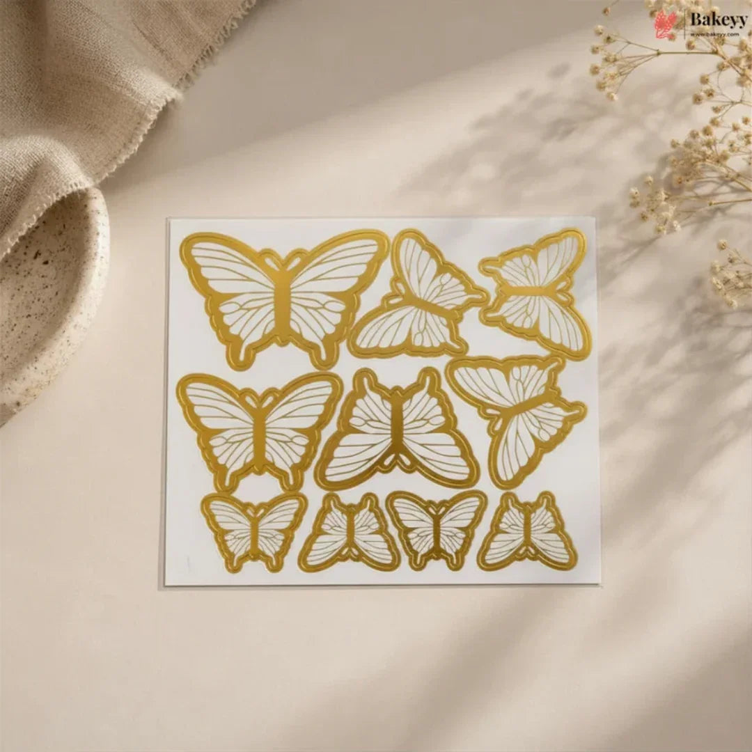 Sheet of gold butterfly designs with dimensions on a beige background
