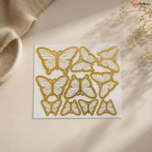 Sheet of gold butterfly designs with dimensions on a beige background