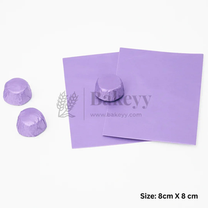 Purple silicone baking mats shown on a white background, with two unwrapped dome-shaped pieces and one wrapped piece on the mat. Text in the corner reads 'Size: 8cm X 8cm'.