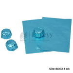 Blue foil cake toppers or fondant sheets shown on a white background, with two wrapped round pieces and a size note reading 8cm x 8cm.