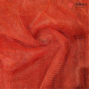 A close-up of draped red-orange sheer mesh fabric with a subtle shimmer, showing its texture and color. A semi-transparent 'Bakeyy' watermark is visible across the center, and a logo for 'Bakeyy Color Studio' appears in the top right corner.