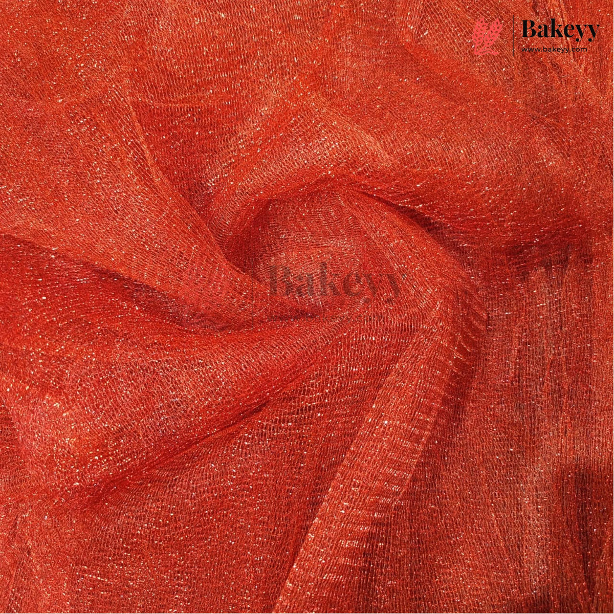 A close-up of draped red-orange sheer mesh fabric with a subtle shimmer, showing its texture and color. A semi-transparent 'Bakeyy' watermark is visible across the center, and a logo for 'Bakeyy Color Studio' appears in the top right corner.
