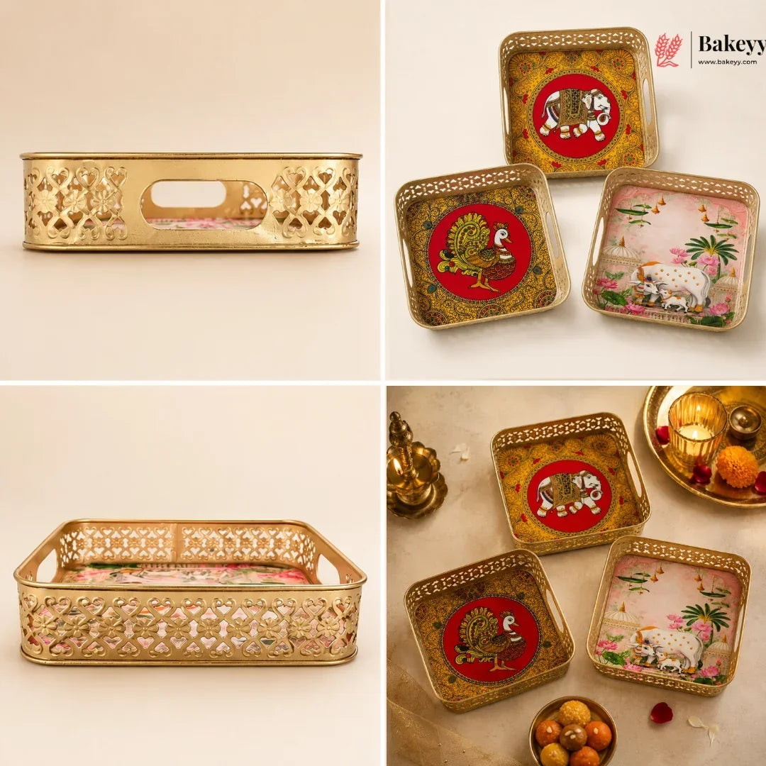 A 2x2 collage showing gold-toned decorative trays and coasters with ornate cutout patterns and printed animal motifs, including a tiger, peacock, and elephant, on a warm beige background. The Bakeey logo appears in the top right.