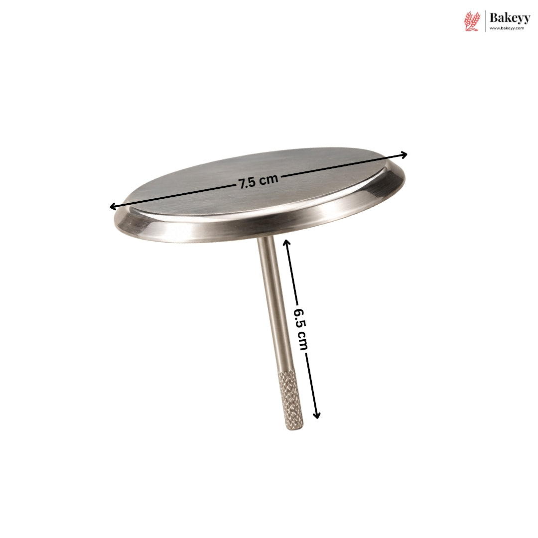 A stainless steel round cake topper with a stem, shown with dimension lines indicating a top diameter of 7.5 cm and a stem height of 6.