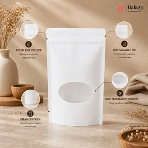 A white stand-up pouch with a resealable zipper, heat sealable top, and oval transparent window, shown on a beige tabletop with decorative dried flowers and props. Callout circles with text explain the pouch features.