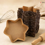 Star-shaped cookie cutter with a stack of similar cutters on a neutral background.