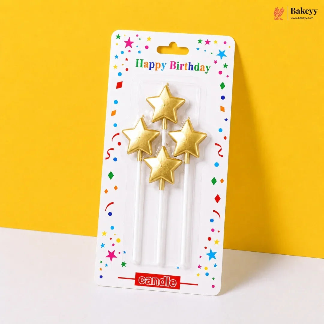 Packaged gold star-shaped birthday candles on a colorful background with 'Bakeyy' branding.