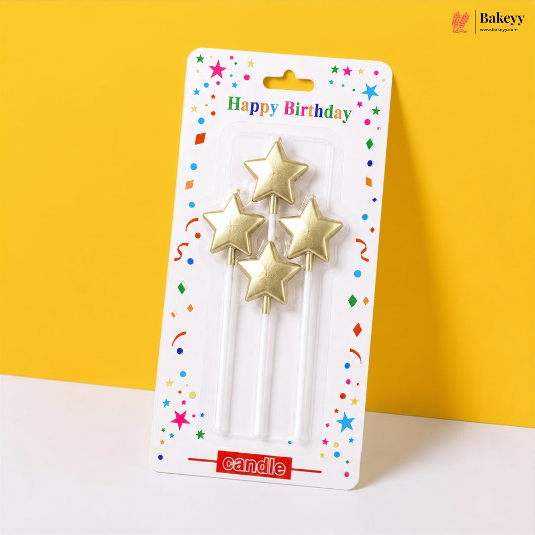 Packaged gold star-shaped birthday candles on a yellow background