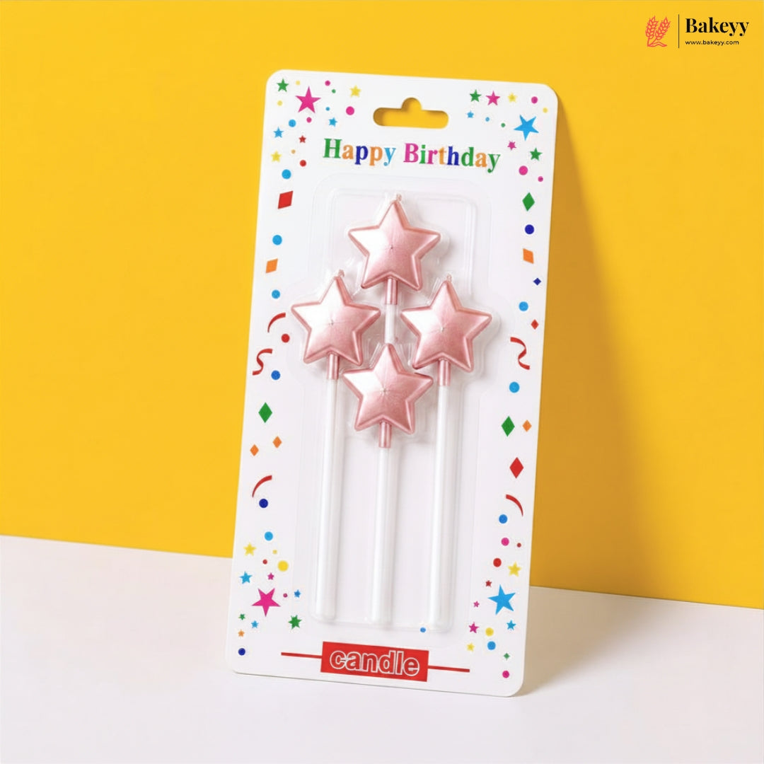 Packaged star-shaped birthday candles with colorful packaging on a yellow background