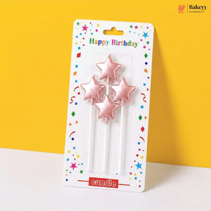 Packaged star-shaped birthday candles with colorful packaging on a yellow background