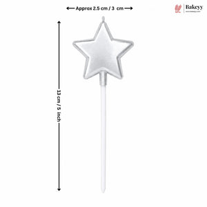 Star-shaped cake topper with dimensions on a white background