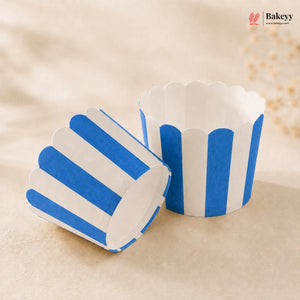 Blue and white striped cupcake liners on a beige background