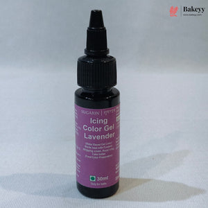 A 30ml bottle of Sugarin Lavender Icing Color Gel with a purple label and black dropper cap, set against a light gray fabric background.