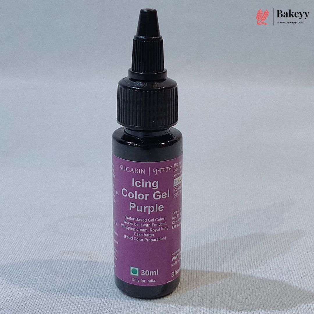 A 30ml bottle of SUGARIN Icing Color Gel in Purple, featuring a black plastic dropper cap and a purple label, set against a light gray fabric background.