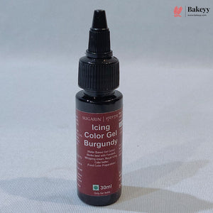 A 30ml bottle of SUGARIN Icing Color Gel in Burgundy, featuring a black plastic dropper cap and a dark red label, set against a light gray textured background.