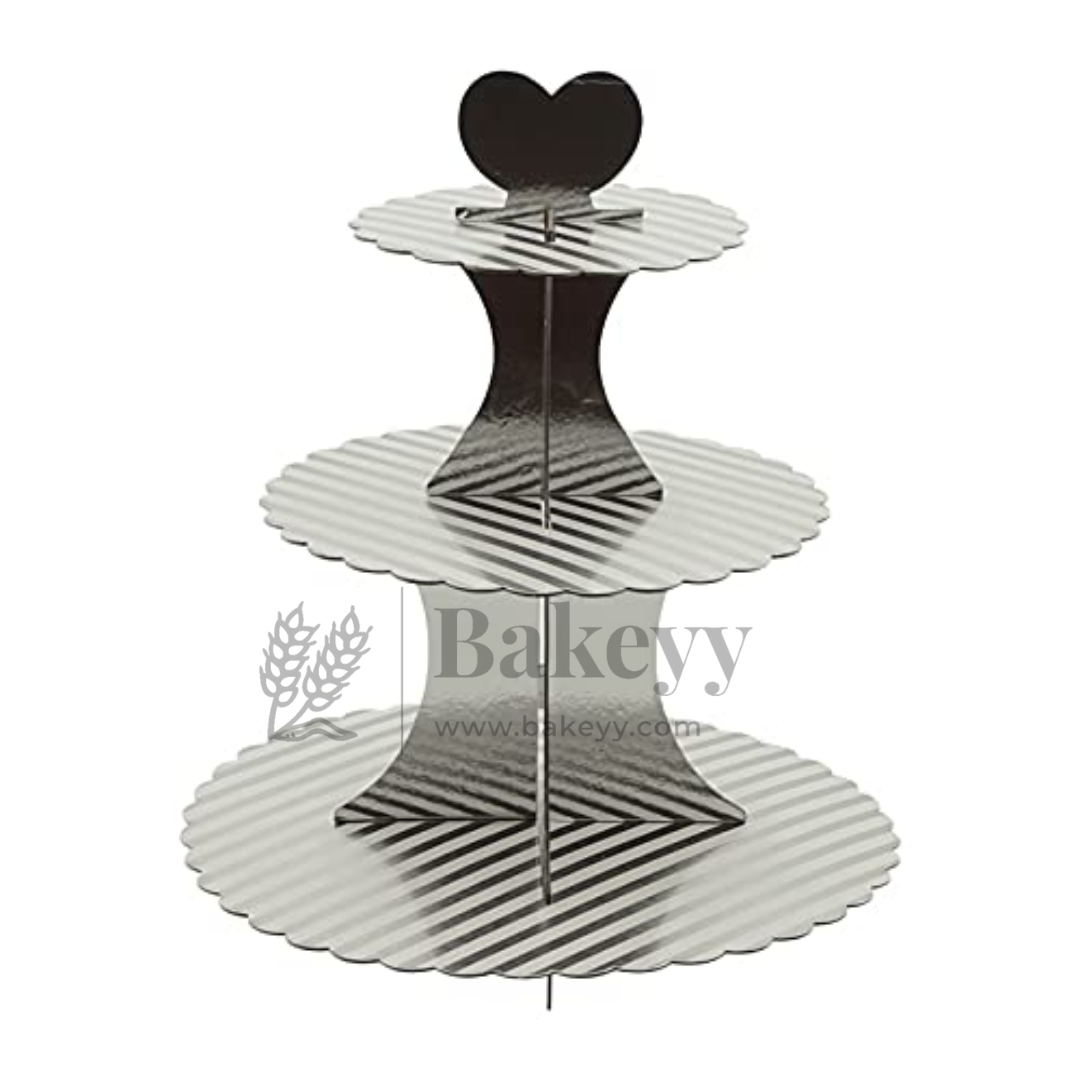 Three-tiered cupcake stand with a heart-shaped top on a white background, branded 'Bakeyy'.