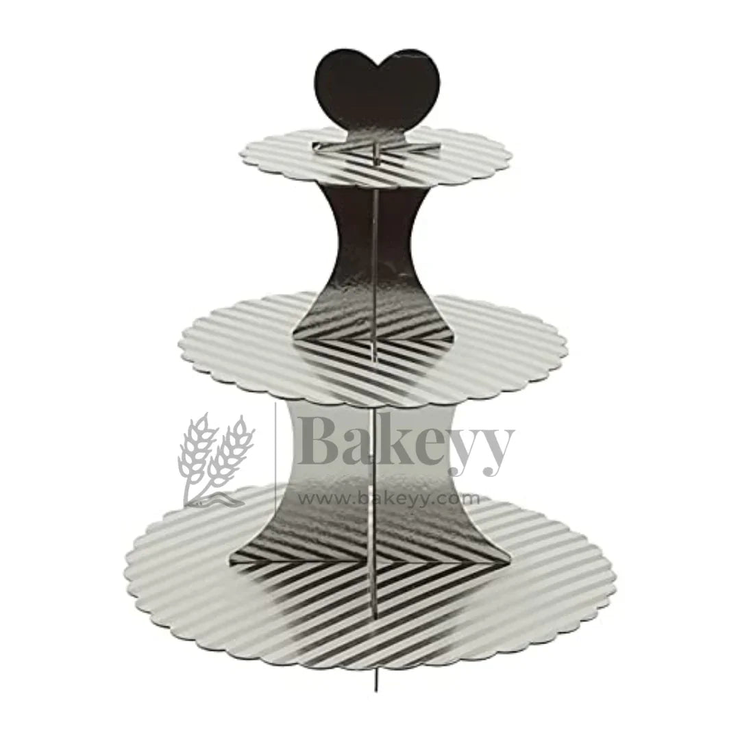 Three-tiered cupcake stand with a heart-shaped top on a white background, branded 'Bakeyy'.