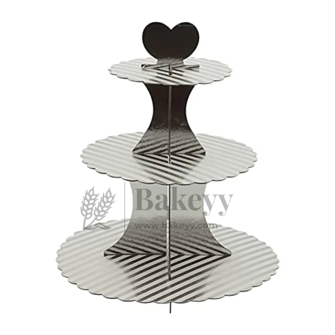 Three-tiered cupcake stand with a heart-shaped top on a white background, branded 'Bakeyy'.
