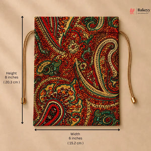 A square fabric pouch with a detailed paisley pattern in red, green, beige, and gold, featuring drawstring ties. The image includes dimension lines indicating a height of 8 inches (20.