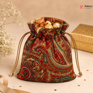 Decorative drawstring bag filled with snacks on a light background