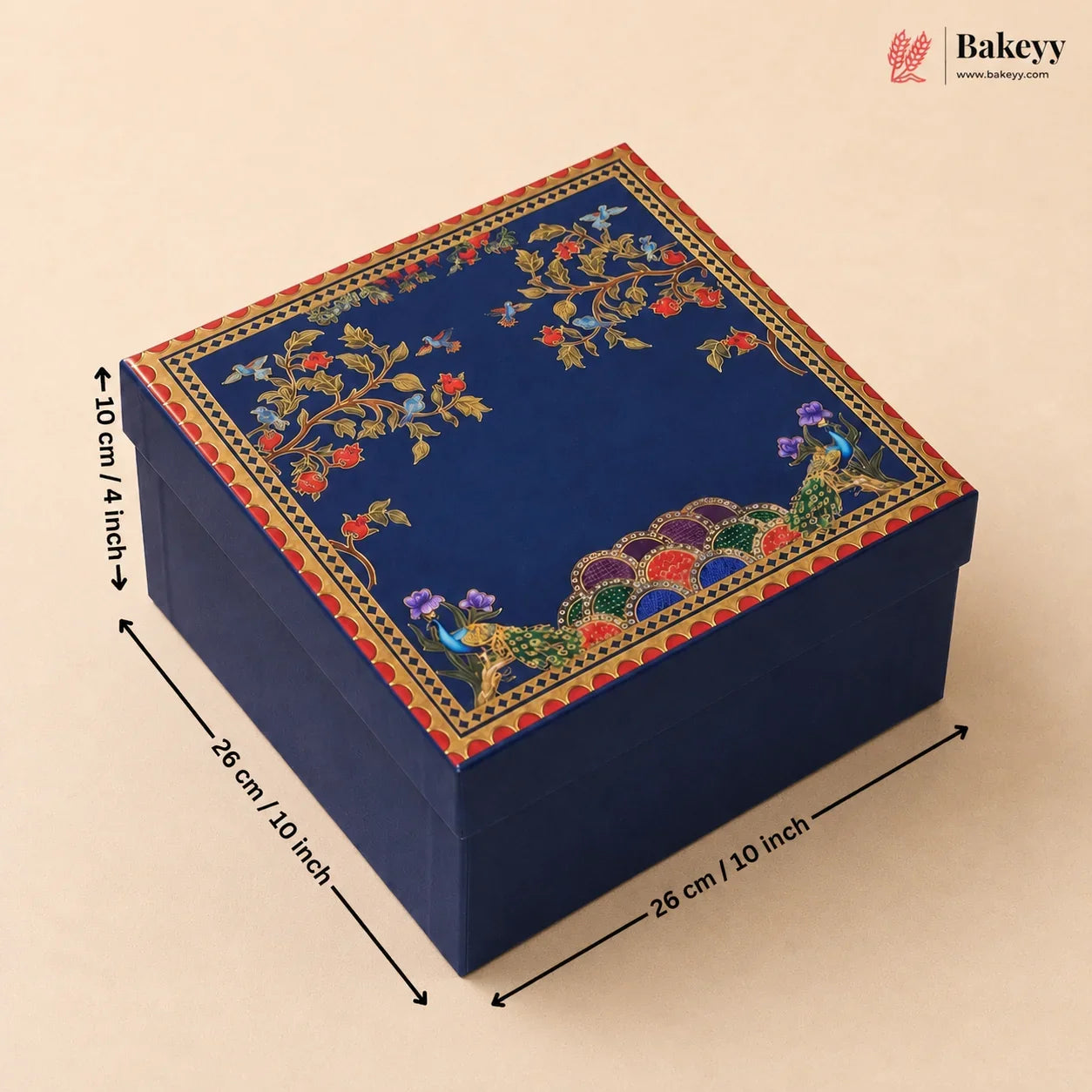 A square navy blue decorative gift box with intricate multicolor floral and peacock embroidery on the lid, shown with dimension arrows and labels indicating 28 cm by 28 cm by 10 cm.