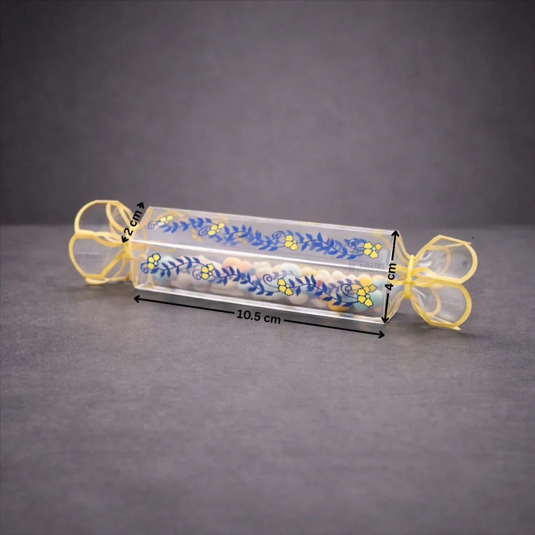 Clear transparent box with decorative floral print
Candy-style shape with twisted ends for a gift-ready look
Ideal for chocolates, candies, toffees, small treats, and favors
Great for birthdays, weddings, baby showers, festive gifting, and hampers
Lightweight, neat presentation, easy to display