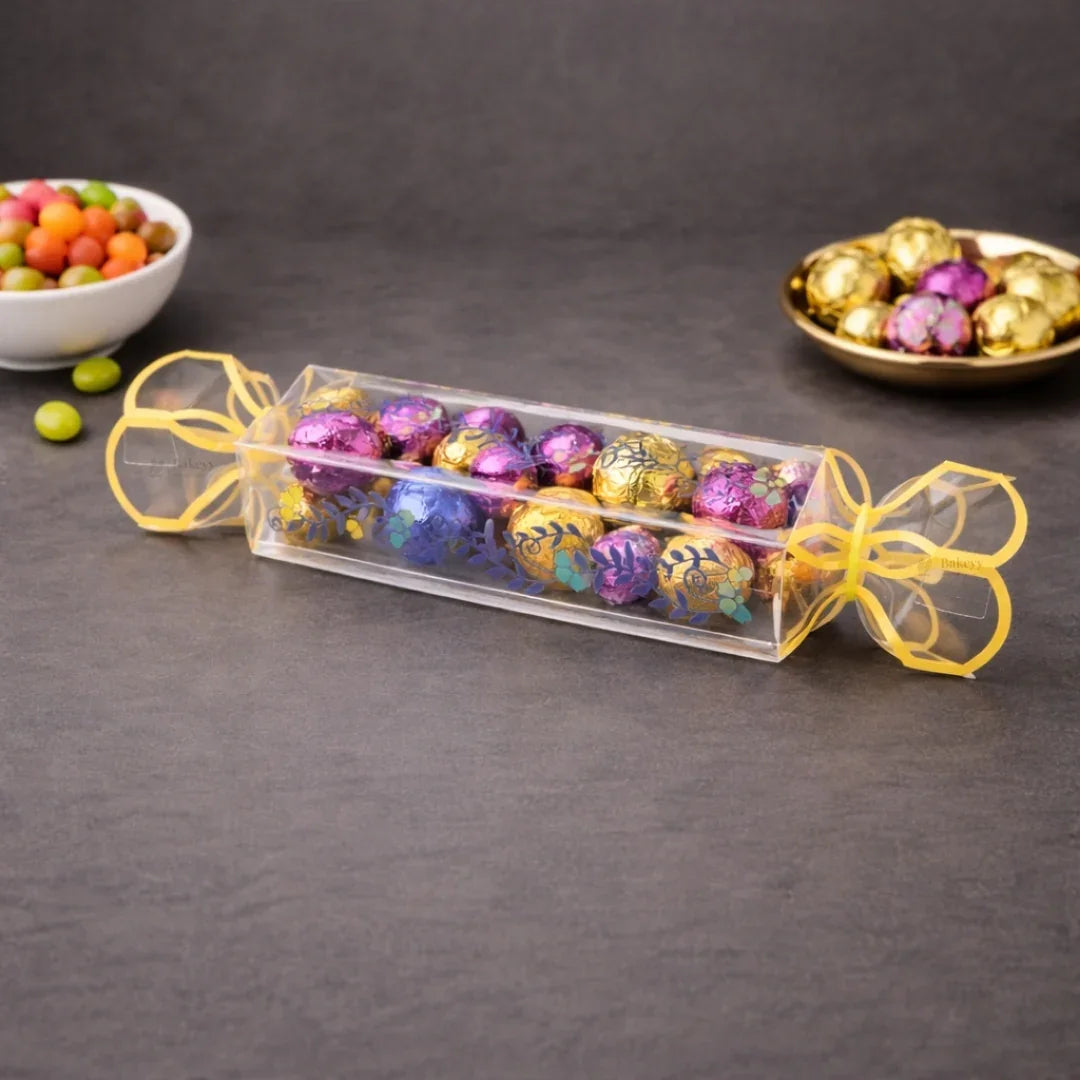 Clear transparent box with decorative floral print
Candy-style shape with twisted ends for a gift-ready look
Ideal for chocolates, candies, toffees, small treats, and favors
Great for birthdays, weddings, baby showers, festive gifting, and hampers
Lightweight, neat presentation, easy to display