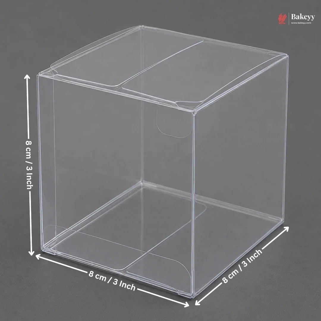 Clear plastic cube with dimensions labeled on a gray background