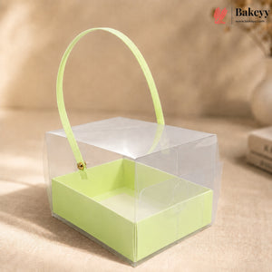 Clear box with a green interior and handle on a beige background, featuring the Bakeyy brand.