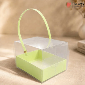 Clear box with a green interior and handle on a beige background, featuring the Bakeyy brand.