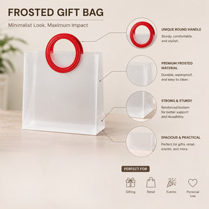 Frosted gift bag with red round handle on a light background