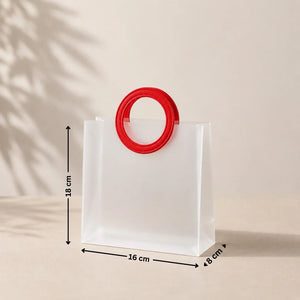 White bag with a red handle and measurements on a beige background
