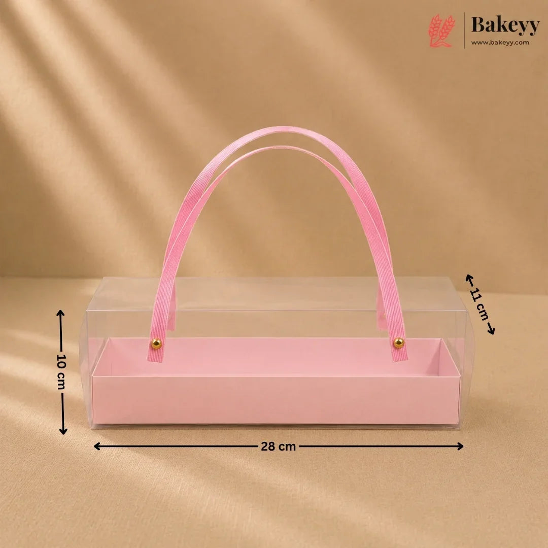 Pink rectangular box with a handle on a beige background, featuring dimensions.